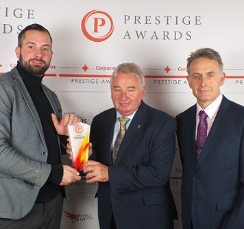 Leeds and West Yorkshire Prestige Awards. Richard Bailey (centre) and Andrew Hirst from EDS Ltd receive the award from Daniel Jones from the Prestige team.