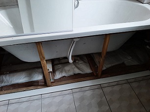 FloodSax beneath the bath in Christine Butler's flat