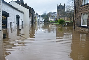 Flooding can devastate local communities. Photo by Chris Gallagher on Unsplash.