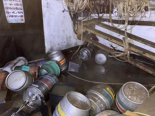 Beer barrels floating in floodwater at the Star pub in Folly Hall, Huddersfield