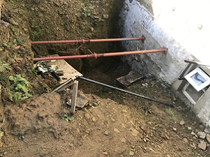 The huge hole Lewyn Clegg has had to dig in his garden to unearth the culvert